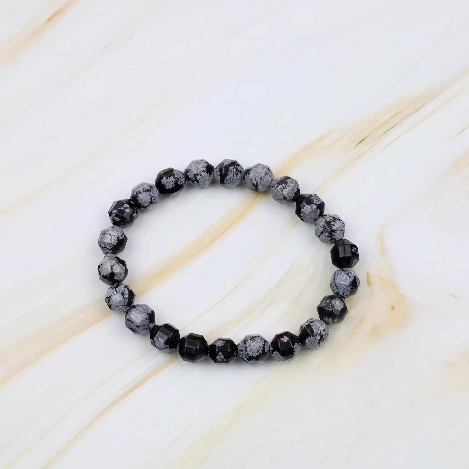 El'Cobre Snowflake Obsidian Satellite Cut krystalarmbånd sort
